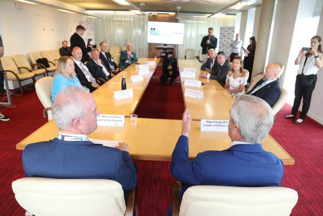 Reform UK leader Nigel Farage with leader of North Northants Council Cllr Martin Griffiths and other members of the executive at the Corby Cube/National World