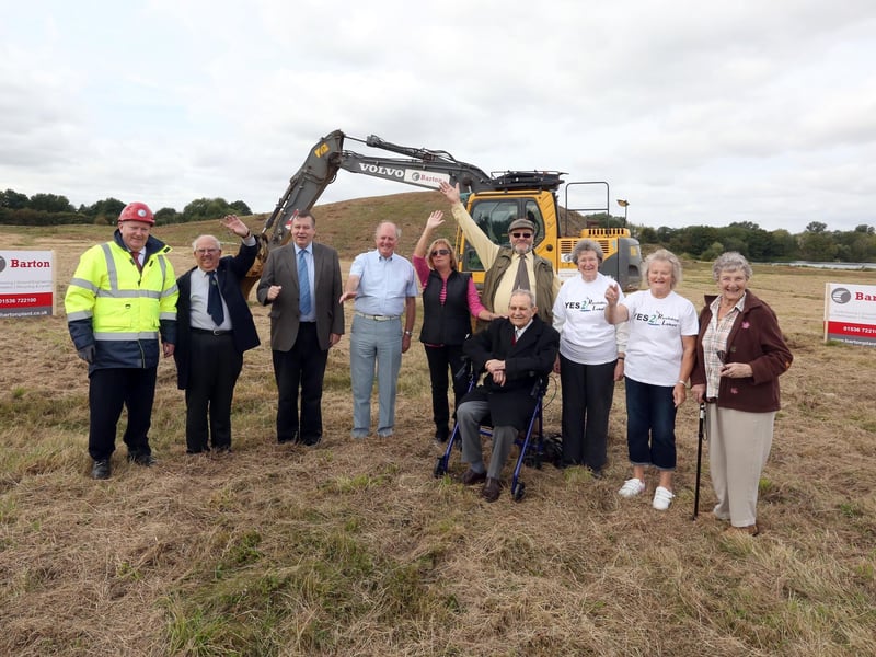 Rushden Lakes supporters with original Skew Bridge owner John Wills (seated) and contractor John Boyce (business development manager Barton Plant and The Bennie Group) in August 2014 with the old Skew Bridge site being cleared for work to begin