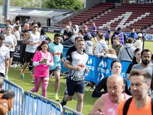 Hundreds of runners braved showers and wind to take on the race on Sunday (May 25), which started and finished at Sixfields stadium.
