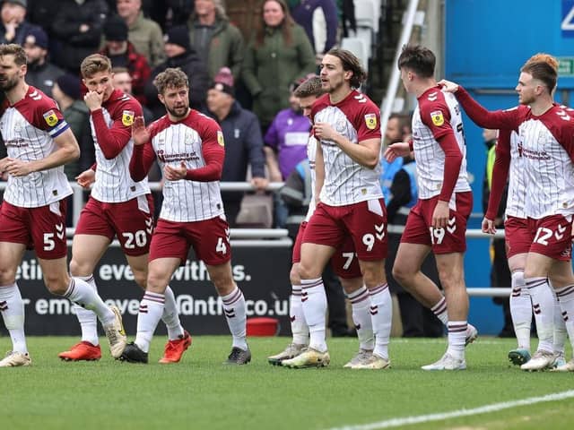 Louis Appéré of Northampton Town celebrates with team-mates after scoring the opening goal during the Sky Bet League Two between Northampton Town and Stevenage at Sixfields on April 01, 2023. (Photo by Pete Norton/Getty Images)