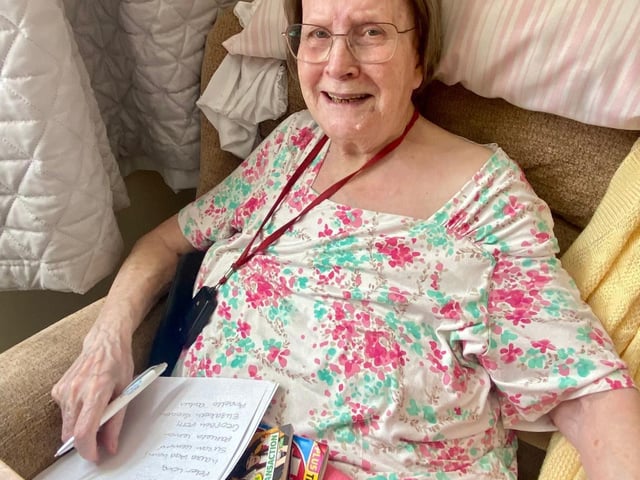 Resident Pam dressed to impress for Pride Month in lovely pinks and white