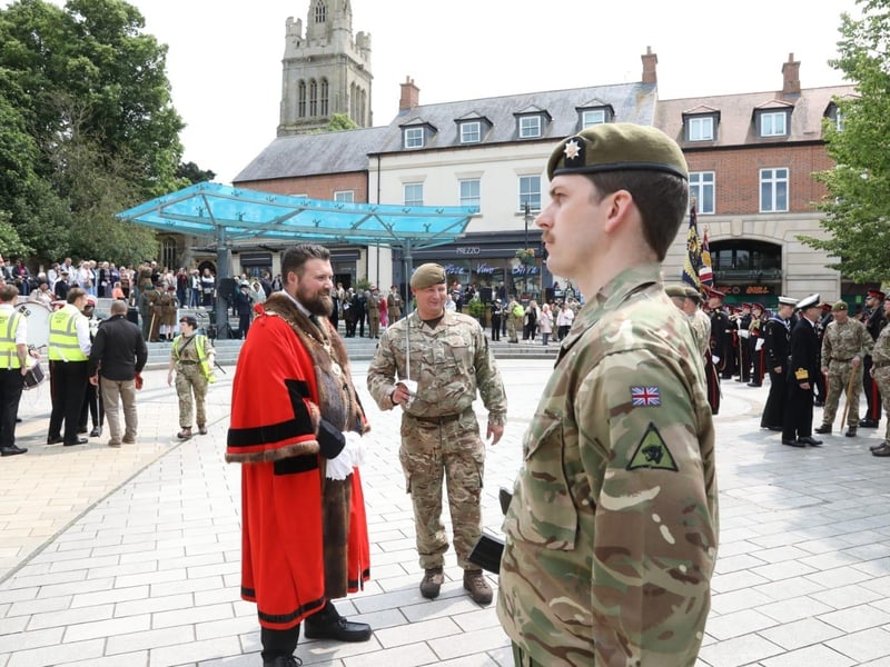 Kettering town centre: crowds line town centre to welcome The Royal Anglian Regiment for Armed Forces Day parade /National World