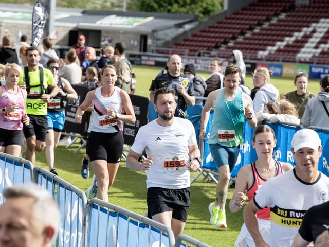 Hundreds of runners braved showers and wind to take on the race on Sunday (May 25), which started and finished at Sixfields stadium.
