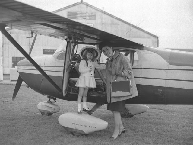 Easter bonnet parade entrant with Cessna aircraft at Sywell, March 30, 1964