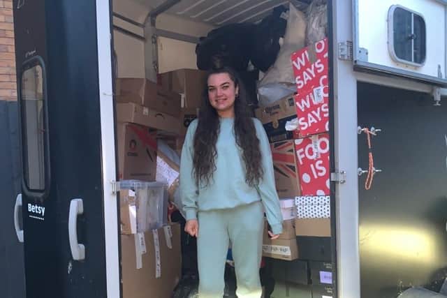 Maddison and some of the donated items.