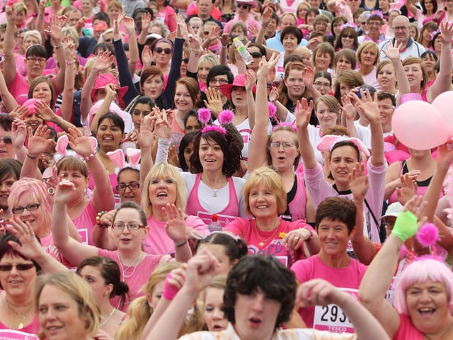 2011 - Over four thousand women warm up before the start in the 5k Race for Life at Abington Park in Northampton.