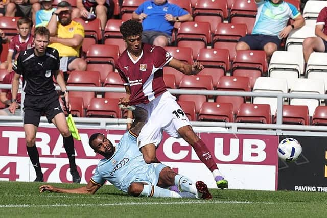 Ethan Wheatley and Curtis Tilt battle for the ball