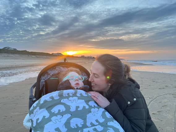 Teddy and Mummy on his first holiday in Bacton.