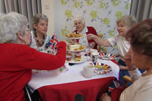 Residents at St. Christopher's Care Home enjoy their Coronation Day Afternoon Tea.