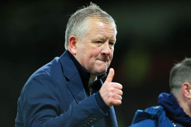 Chris Wilder gestures to supporters on the pitch after the English FA Cup fourth round football match between Manchester United and Middlesbrough at Old Trafford on February 4, 2022. (Photo by LINDSEY PARNABY/AFP via Getty Images)