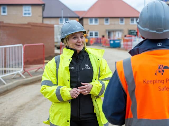 B&DWC - SGB-5222 - Lizz on site talking to a colleague
