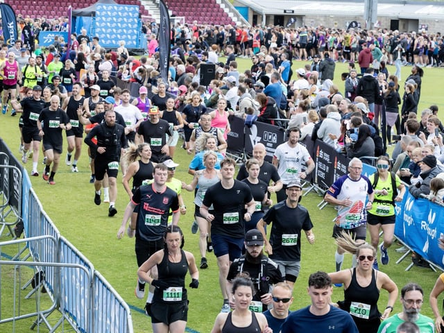 Hundreds of runners braved showers and wind to take on the race on Sunday (May 25), which started and finished at Sixfields stadium.