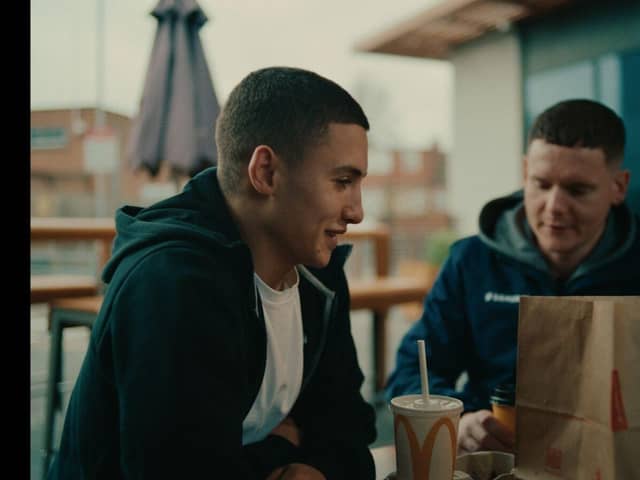 A Youth Worker catches up with a young person at McDonald's