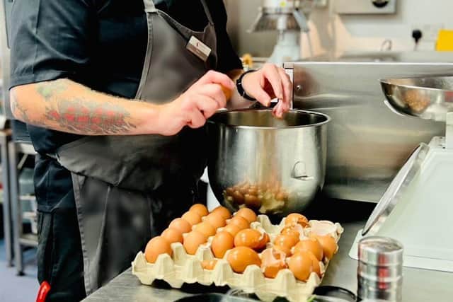 Simon Lewis preparing some of his dishes