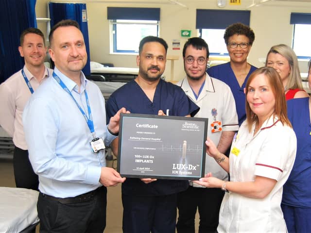 Jon Holton from Boston Scientific presents Principal Cardiac Physiologist Leanne Kelly, and the cardiac team, with a certificate to mark the achievement