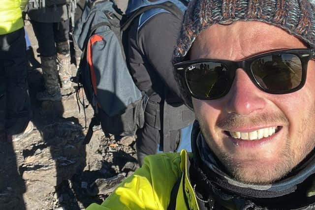 Ben at the top of Mount Kilimanjaro