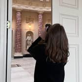 Photographer taking a shot of the Marble Saloon at Stowe House