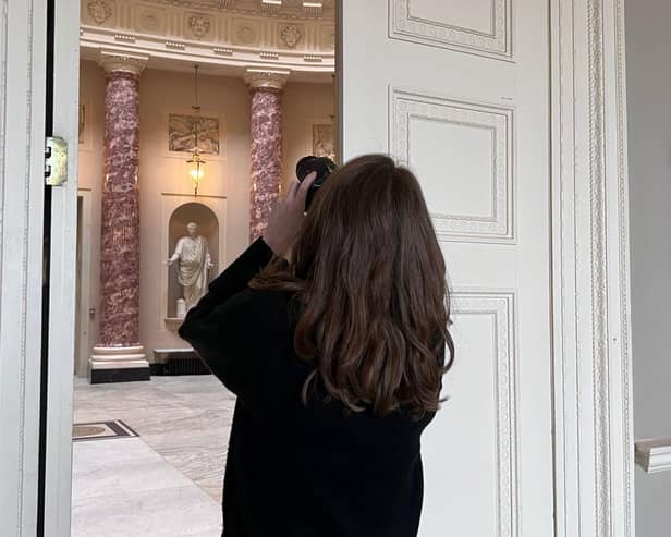 Photographer taking a shot of the Marble Saloon at Stowe House