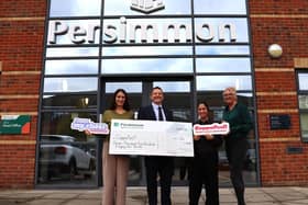 Persimmon Midlands and the team from CoppaFeel! receive the cheque at the Northampton office