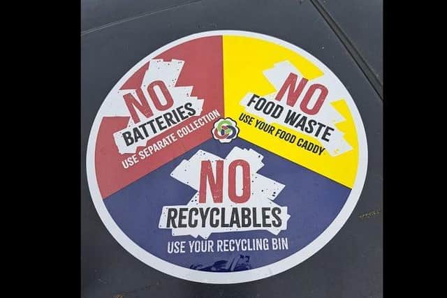 A circular sticker with three segments describing what not to put in a refuse bin