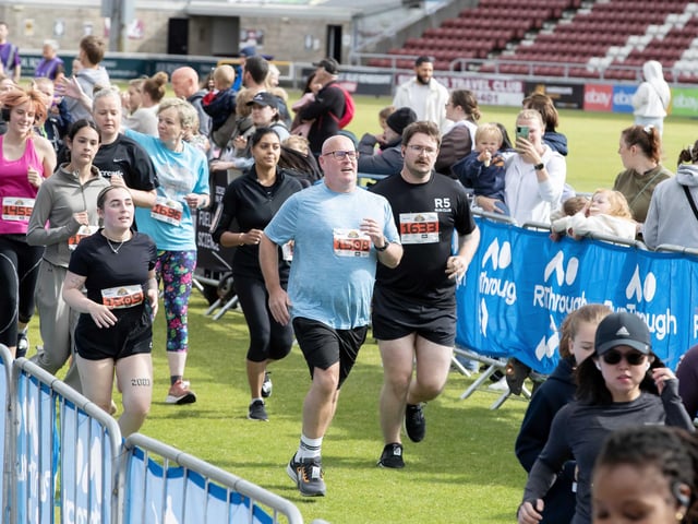 Hundreds of runners braved showers and wind to take on the race on Sunday (May 25), which started and finished at Sixfields stadium.