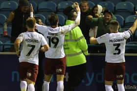 Kieron Bowie celebrates in front of the away fans after scoring a stoppage-time equaliser against Carlisle United on Saturday.
