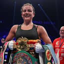 On top of the world... Chantelle Cameron shows off her WBA, WBC, IBF and WBO world super lightweight world title belts (Picture: Mark Robinson Matchroom Boxing)