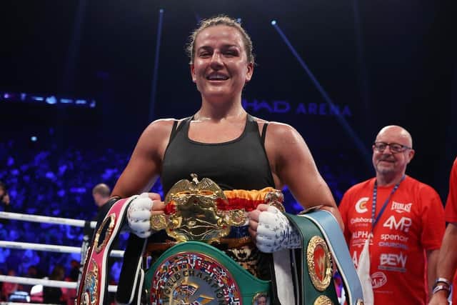 On top of the world... Chantelle Cameron shows off her WBA, WBC, IBF and WBO world super lightweight world title belts (Picture: Mark Robinson Matchroom Boxing)