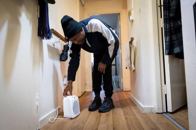 Man adjusting dehumidifier