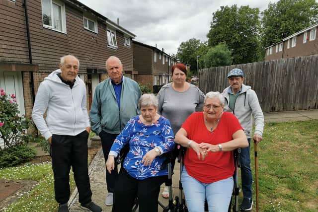 Jen Linekar (front left) and Carol Noon (front right) have called on WNC to fix the potholes and paving slabs in their area