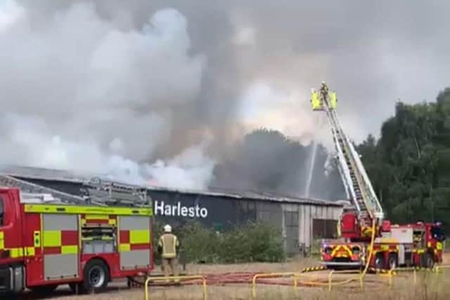 Firefighters at the scene of the fire within Harlestone Firs. Picture and video by Althorp Estate Conservation @AlthorpCons