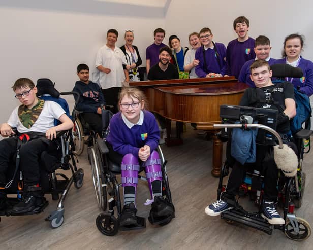 Billy Lockett visiting Greenfields Specialist School For Communication to donate the piano he wrote his debut album on. Photo by David Jackson.