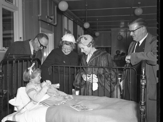 This is the children's ward at Manfield Hospital, Northampton, in 1958 when matron Miss EM Edmonds showed around film star Muriel Pavlow