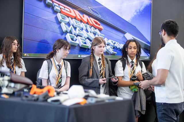 Northampton School for Girl students inside the Digital Manufacturing Centre which specialises in engineering and manufacturing lightweight but exceptionally strong components for space and automotive applications from its HQ at Silverstone Park