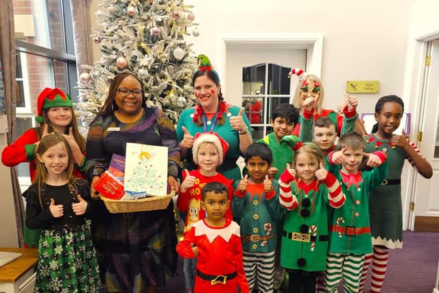 General Manager at Elm Bank Care home, receiving a lovely hamper of goodies from the elves
