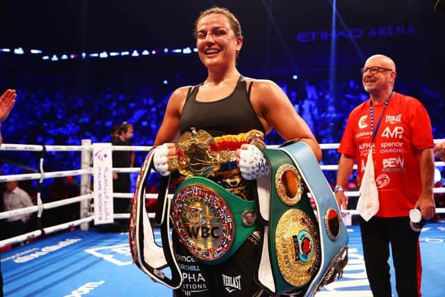Chantelle Cameron shows off her world title belts