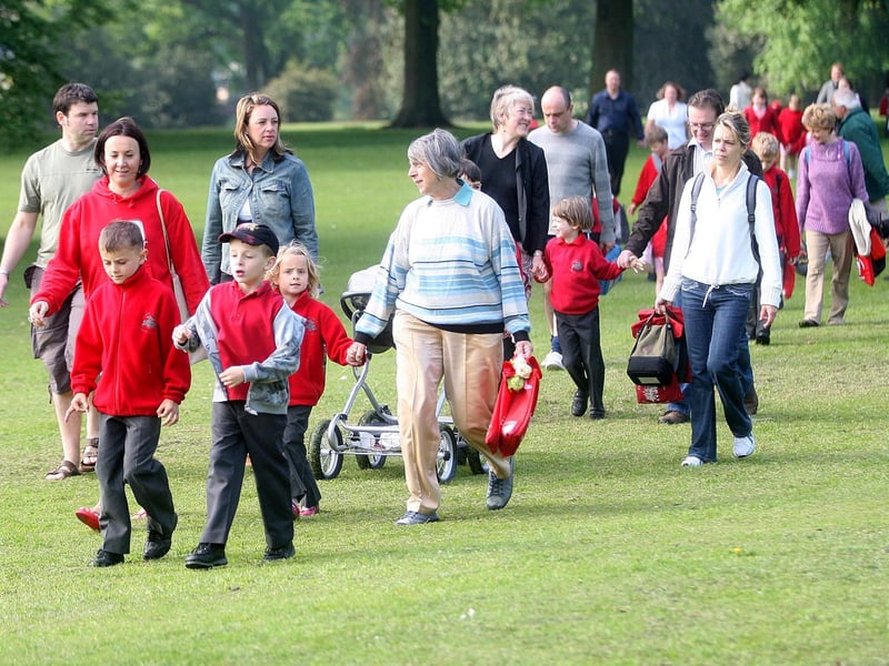 Cedar Road Primary School pupils, parents and staff walking from Abington Park playground to school as part of 'Walk To School' week.