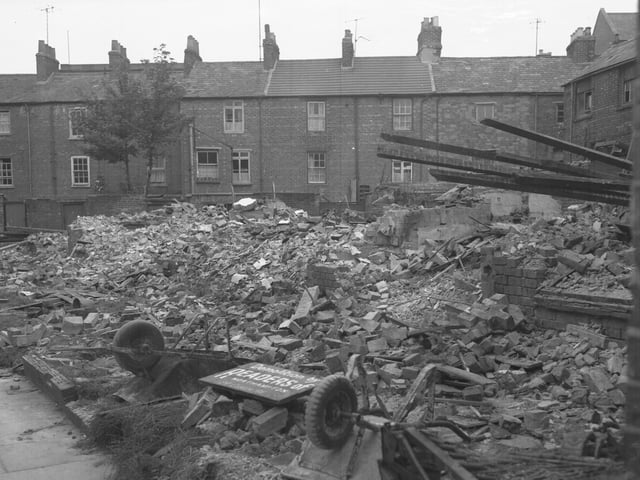 Sign reads: "Demolition by Readers of Northampton"