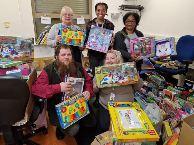 Social workers with gifts donated to the Mother Christmas appeal 2023 in Wellingborough