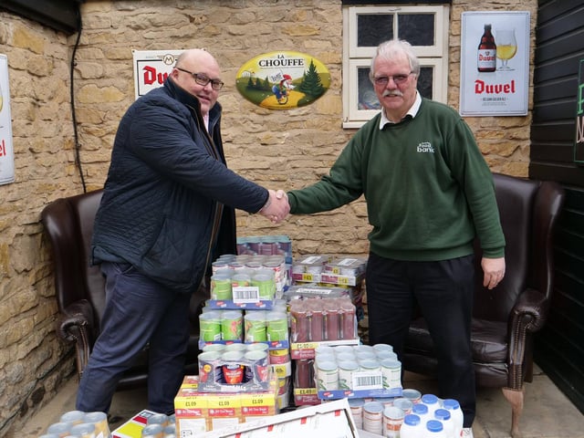 Richard Gordon of Greedy Gordons with Kettering Foodbank volunteer driver Ken Ansdell.