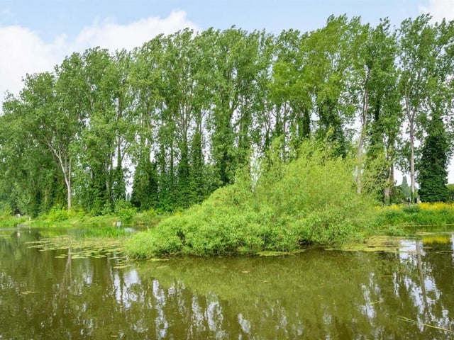 This Victorian home has a tennis court, huge gardens and a private mooring on the River Nene.