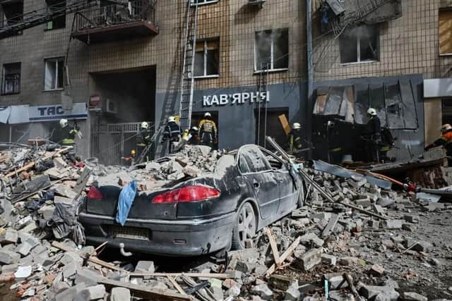 Firefighters search rubble after an apartment was hit by a missile strike in Kharkiv on September 6  amid the Russian invasion of Ukraine