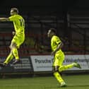 Callum Stead jumps for joy after scoring Brackley Town's winner in their 2-1 success at Kidderminster Harriers on Tuesday. Pictures by Glenn Alcock