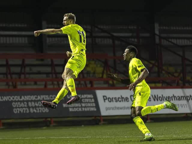 Callum Stead jumps for joy after scoring Brackley Town's winner in their 2-1 success at Kidderminster Harriers on Tuesday. Pictures by Glenn Alcock
