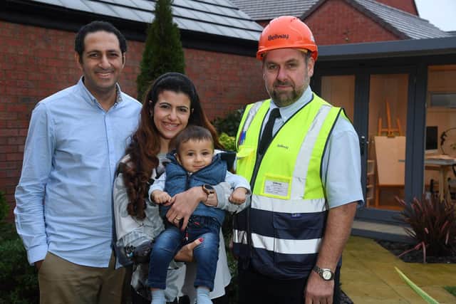 Homebuyers Samy Salib and Sara Azer with Bellway Site Manager Steve Beck (right) and Baby Steve