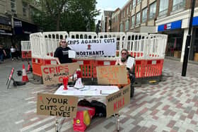 Crips Against Cuts in action on a stall in Northampton Town Centre