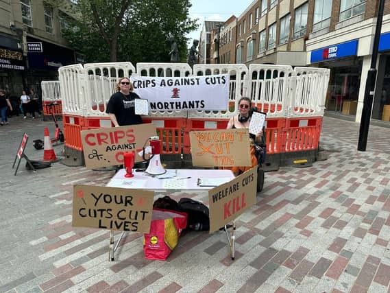 Crips Against Cuts in action on a stall in Northampton Town Centre