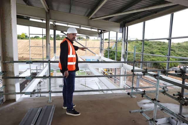 Kelvin Thomas leads a tour around the East Stand as work continues. Pictures: Pete Norton