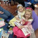 Parents at Queen Eleanor Primary read with their children to mark the start of World Book Day