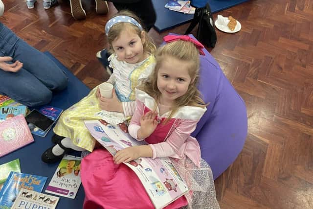 Parents at Queen Eleanor Primary read with their children to mark the start of World Book Day